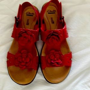 Red wedge Clark sandal. Floral and topstitch detailing.